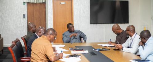 The Minister for Roads and Highways, Hon. Kwame Governs Agbodza, staff of the Ministry of Roads and Highways, and Newmont representatives signing the MoU for the Sunyani-Akyerensua road