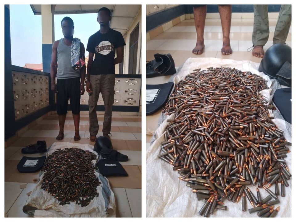 Police arrested a driver and his mate after uncovering 2,600 rounds of AK-47 ammunition on their bus.